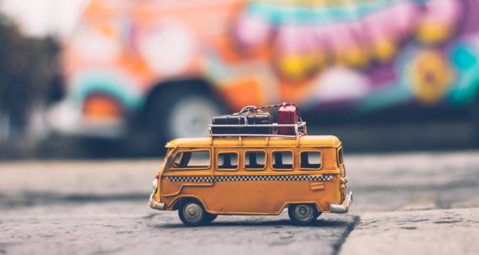 selective focus photography of yellow school bus die cast