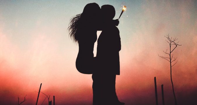 silhouette of kissing couple