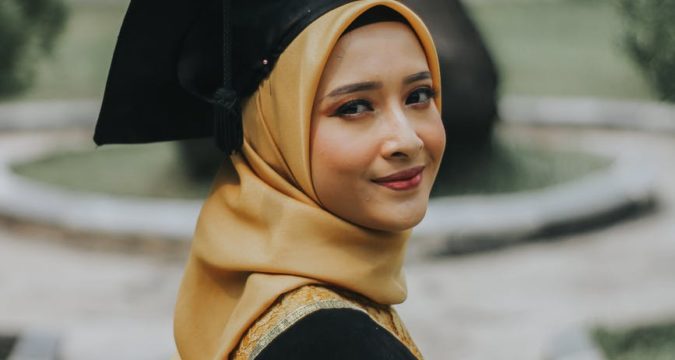woman wearing black square academic cap